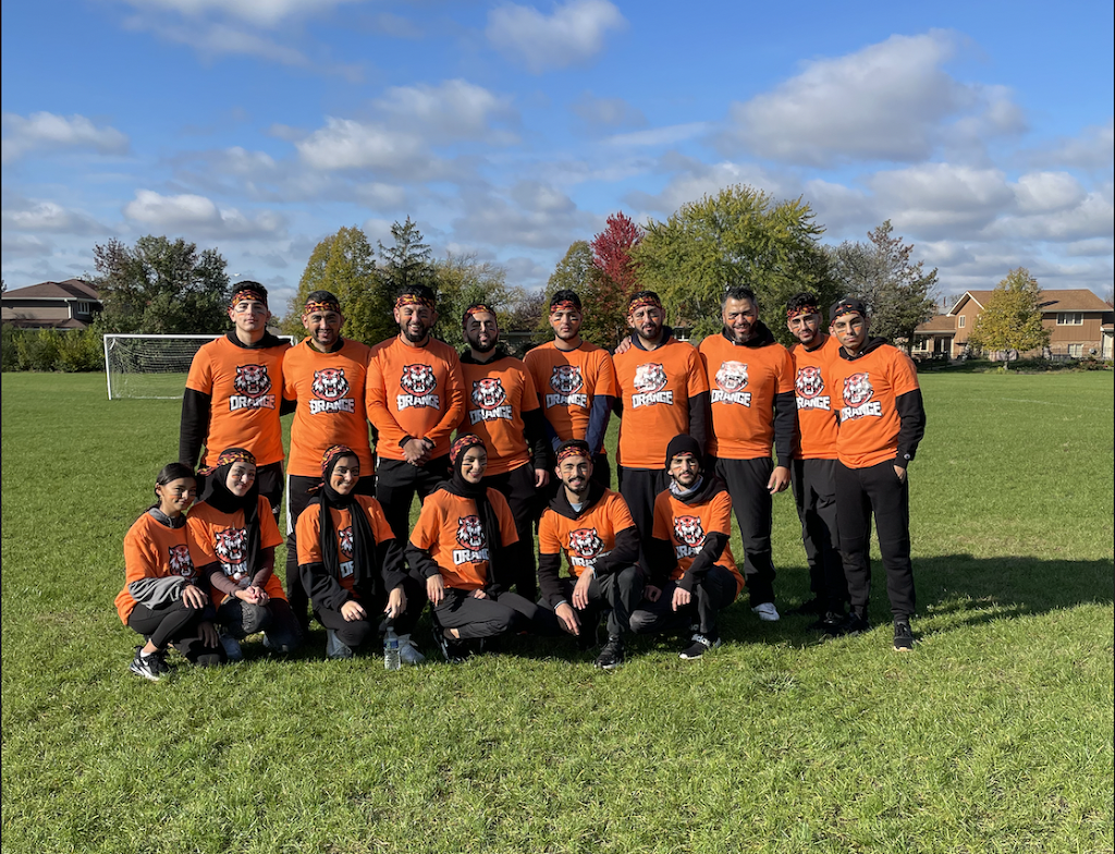 Team in custom orange shirts